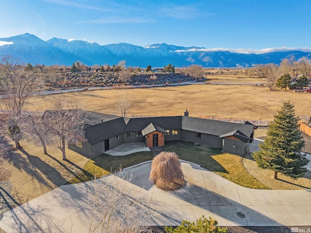 birds eye view of property featuring a mountain view