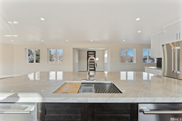 kitchen featuring appliances with stainless steel finishes, plenty of natural light, and sink