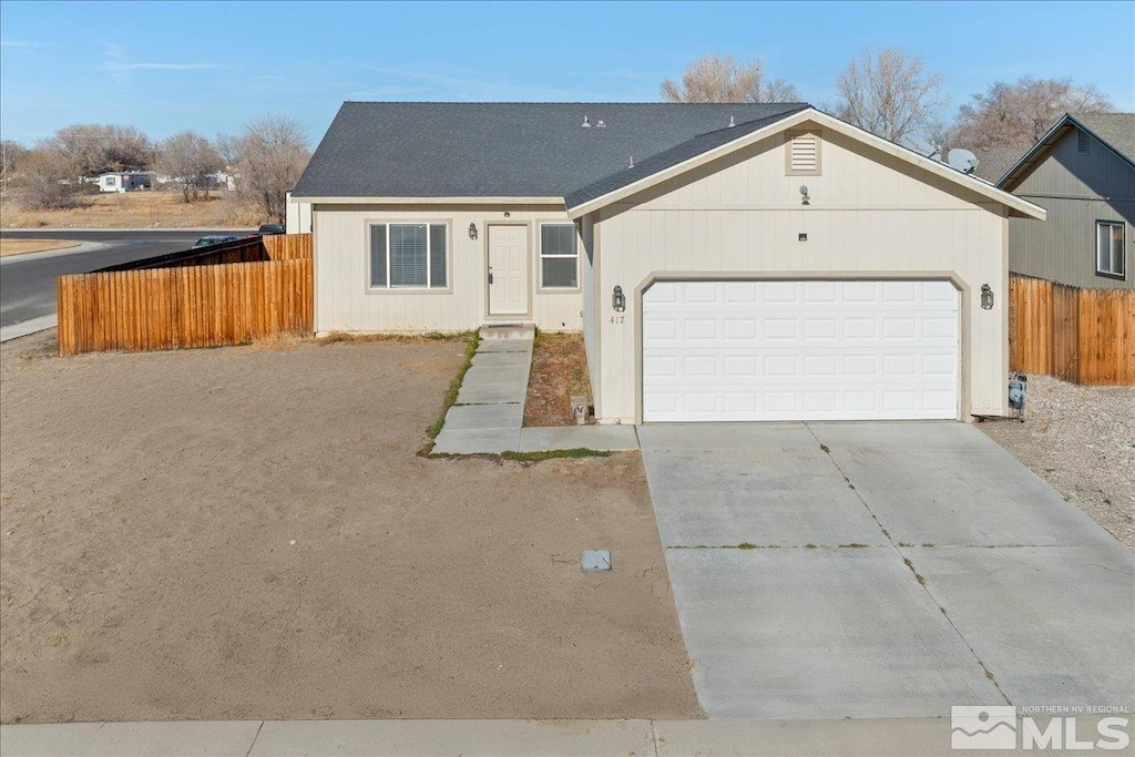 ranch-style home featuring a garage