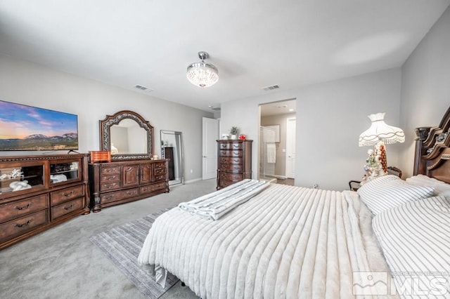 bedroom featuring light colored carpet