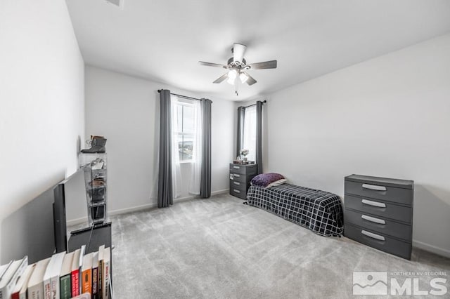 sitting room featuring light carpet and ceiling fan