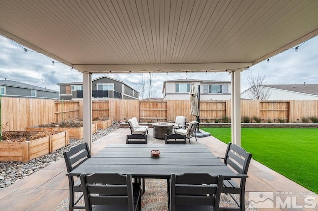 view of patio with an outdoor fire pit