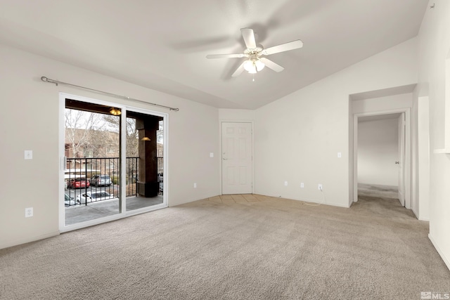 carpeted spare room with ceiling fan and lofted ceiling