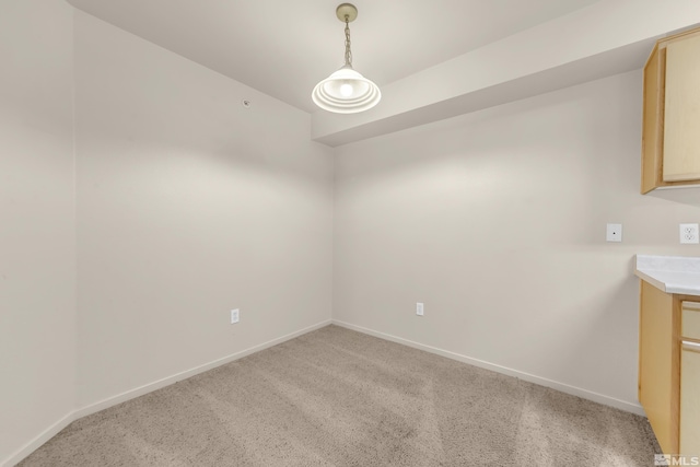 unfurnished room with light colored carpet