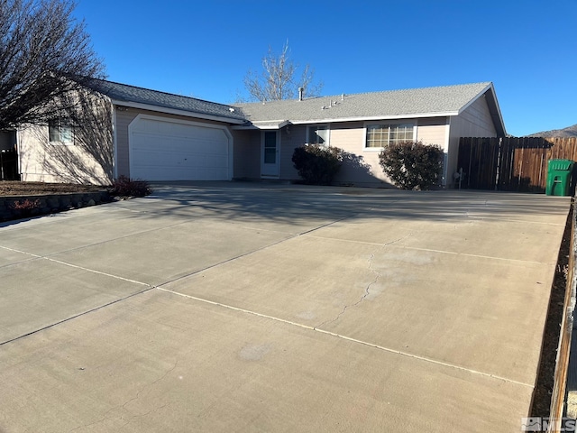 ranch-style home with a garage