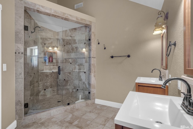 bathroom with vanity and an enclosed shower