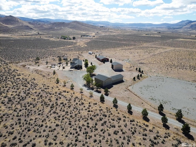 birds eye view of property featuring a mountain view