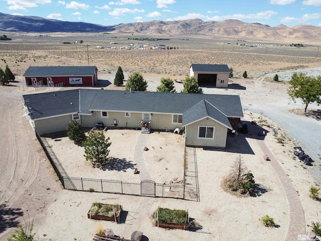 birds eye view of property with a mountain view