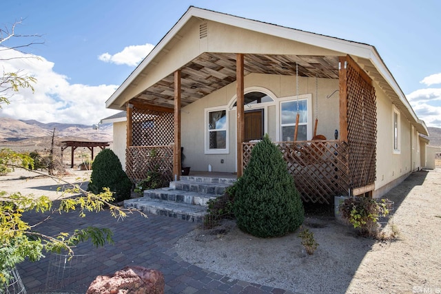 view of front facade featuring a mountain view