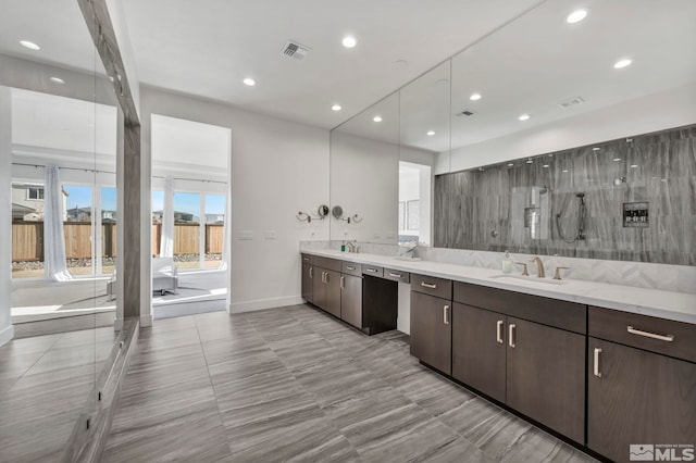 kitchen with dark brown cabinetry and sink