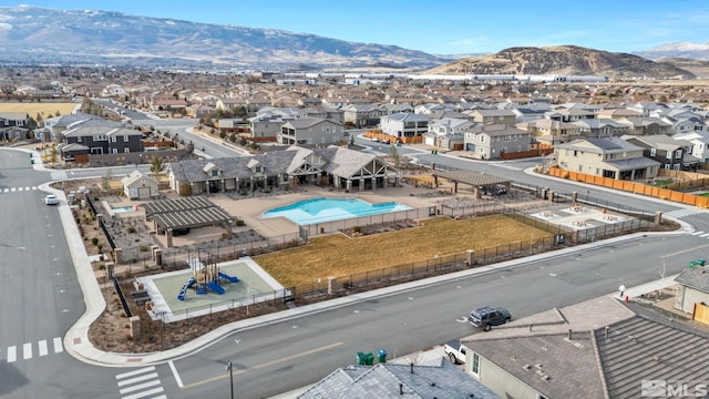 birds eye view of property with a mountain view