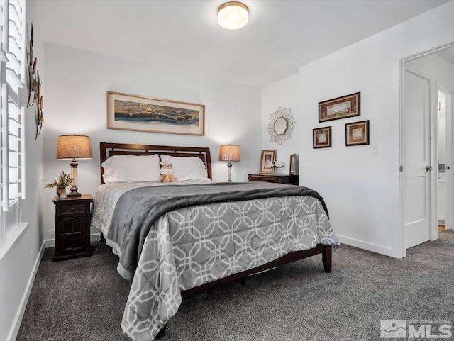 bedroom featuring dark colored carpet