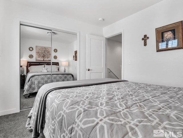 carpeted bedroom with a closet