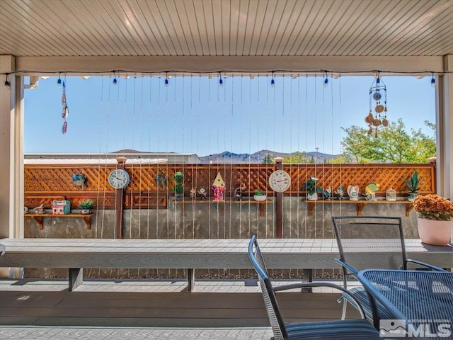 wooden deck with a mountain view