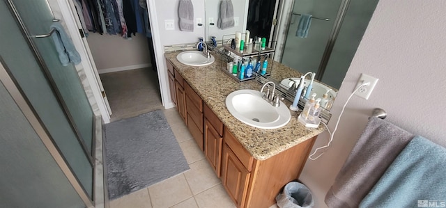 bathroom featuring tile patterned flooring and vanity