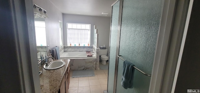 full bathroom featuring tile patterned flooring, vanity, toilet, and plus walk in shower