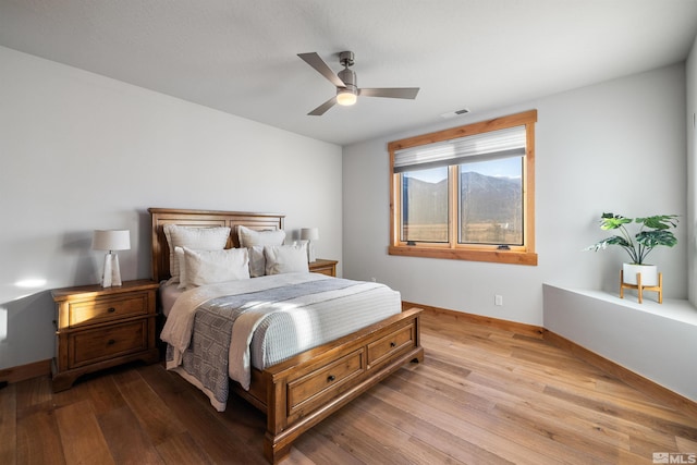 bedroom featuring ceiling fan and light hardwood / wood-style floors