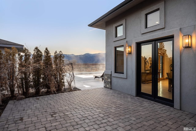 patio terrace at dusk with a mountain view