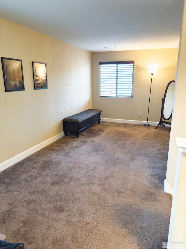 unfurnished room with carpet floors