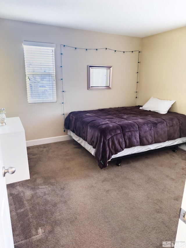 bedroom with dark carpet