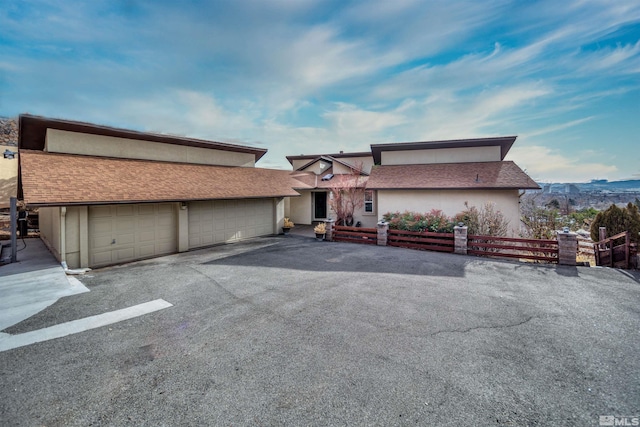 view of front of property with a mountain view and a garage