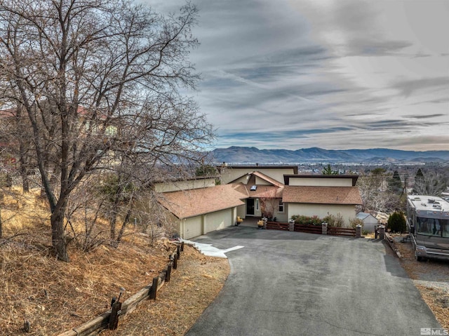 view of front of property featuring a mountain view and a garage