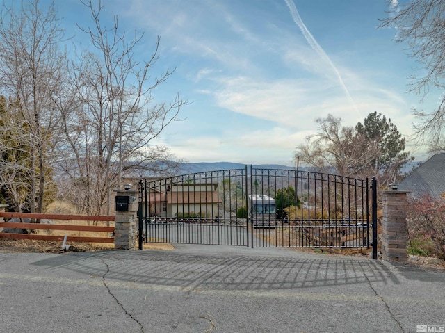 view of gate featuring a mountain view