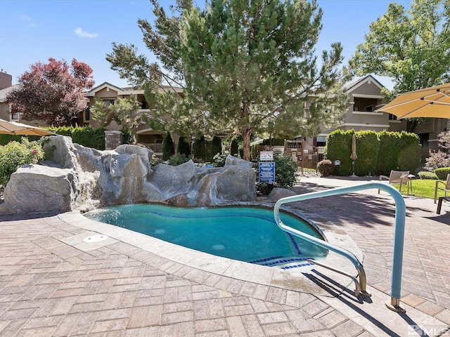 view of pool featuring pool water feature