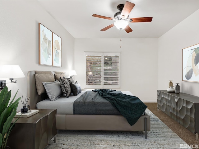 carpeted bedroom featuring ceiling fan