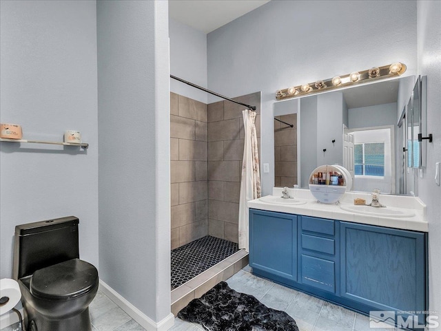 bathroom featuring a shower with curtain, toilet, and vanity