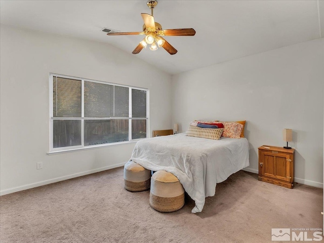 carpeted bedroom featuring ceiling fan and vaulted ceiling