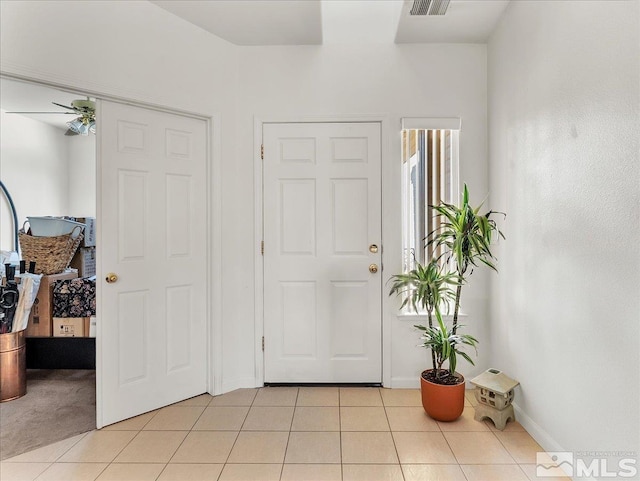 foyer featuring light tile patterned flooring