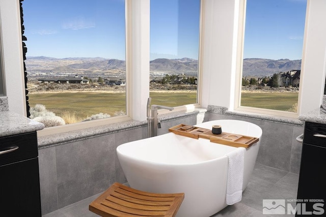 sunroom / solarium with a mountain view