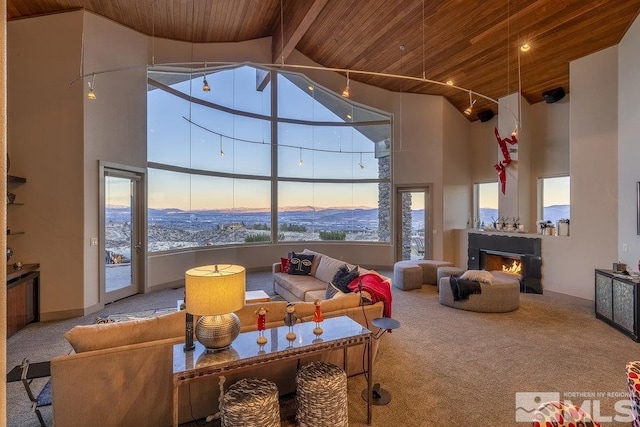 interior space featuring beamed ceiling, wooden ceiling, and high vaulted ceiling