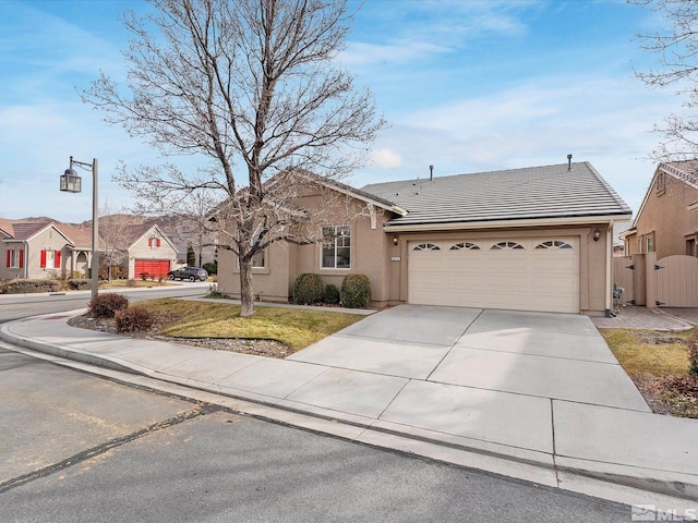 ranch-style home with a garage