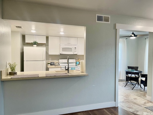 kitchen with ceiling fan, white cabinets, white appliances, and light wood-type flooring