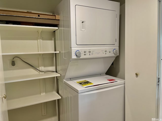 laundry room featuring stacked washer and dryer