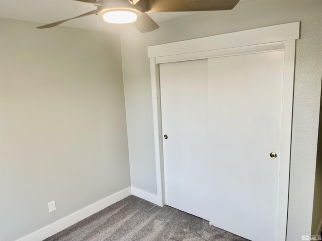 unfurnished bedroom featuring carpet flooring, a closet, and ceiling fan