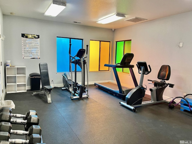 workout area featuring a textured ceiling