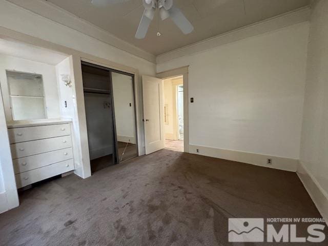 unfurnished bedroom featuring ceiling fan, carpet floors, ornamental molding, and a closet