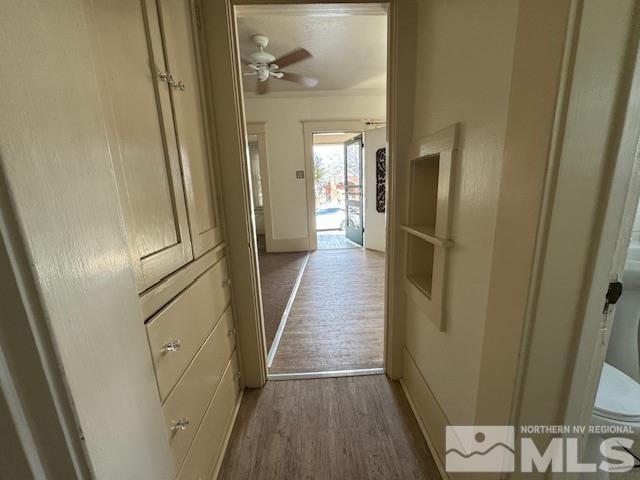 corridor featuring wood-type flooring