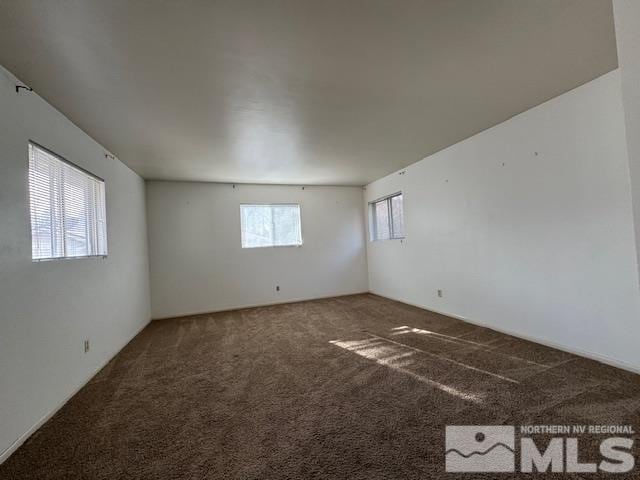 unfurnished room with carpet floors