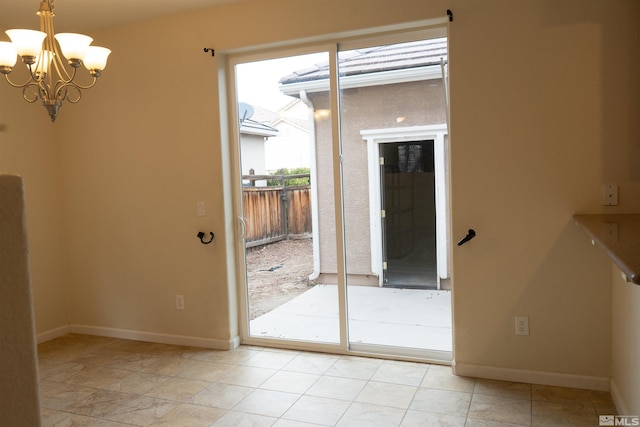 entryway with an inviting chandelier