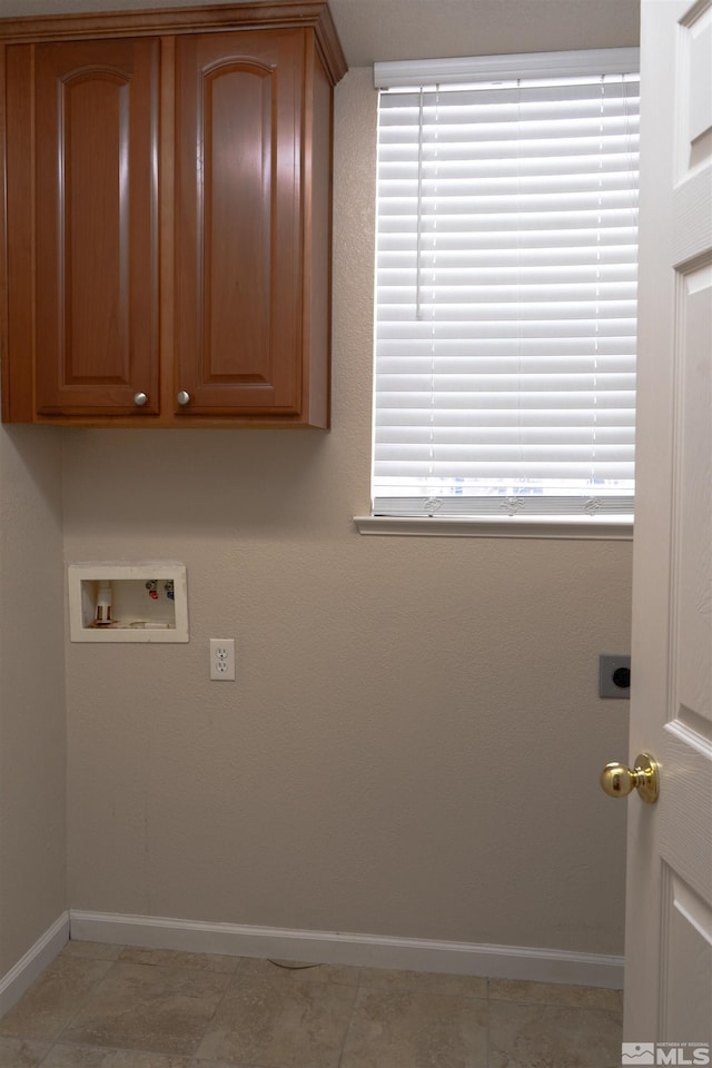 laundry room with hookup for an electric dryer, washer hookup, and light tile patterned floors