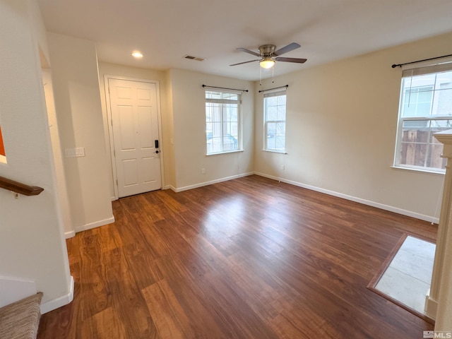 interior space with ceiling fan and dark hardwood / wood-style flooring