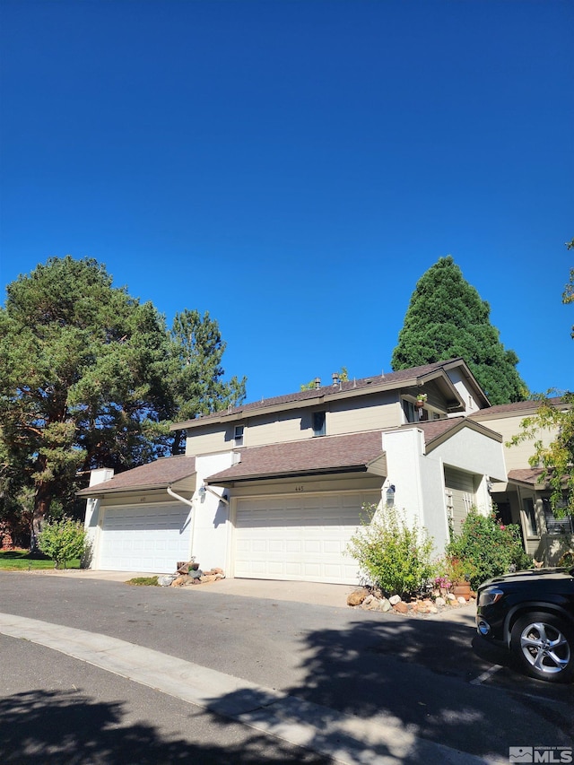 view of front of property with a garage