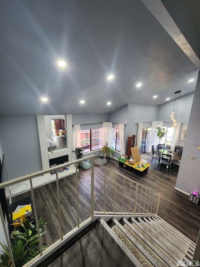 kitchen with hardwood / wood-style floors and vaulted ceiling