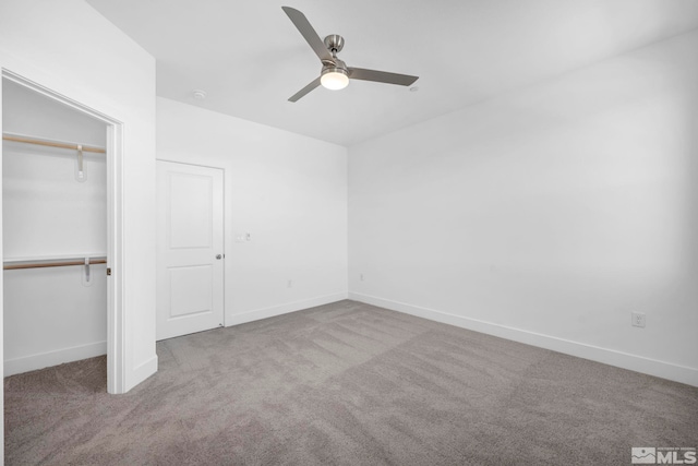 unfurnished bedroom with light colored carpet, a closet, and ceiling fan