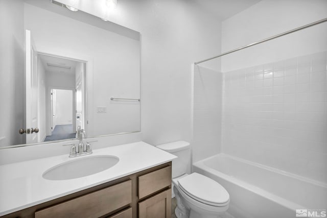 full bathroom featuring shower / bathtub combination, vanity, and toilet