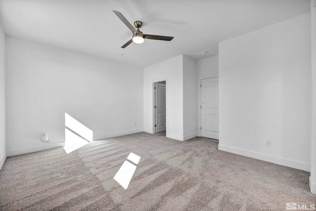 unfurnished bedroom with ceiling fan and light colored carpet